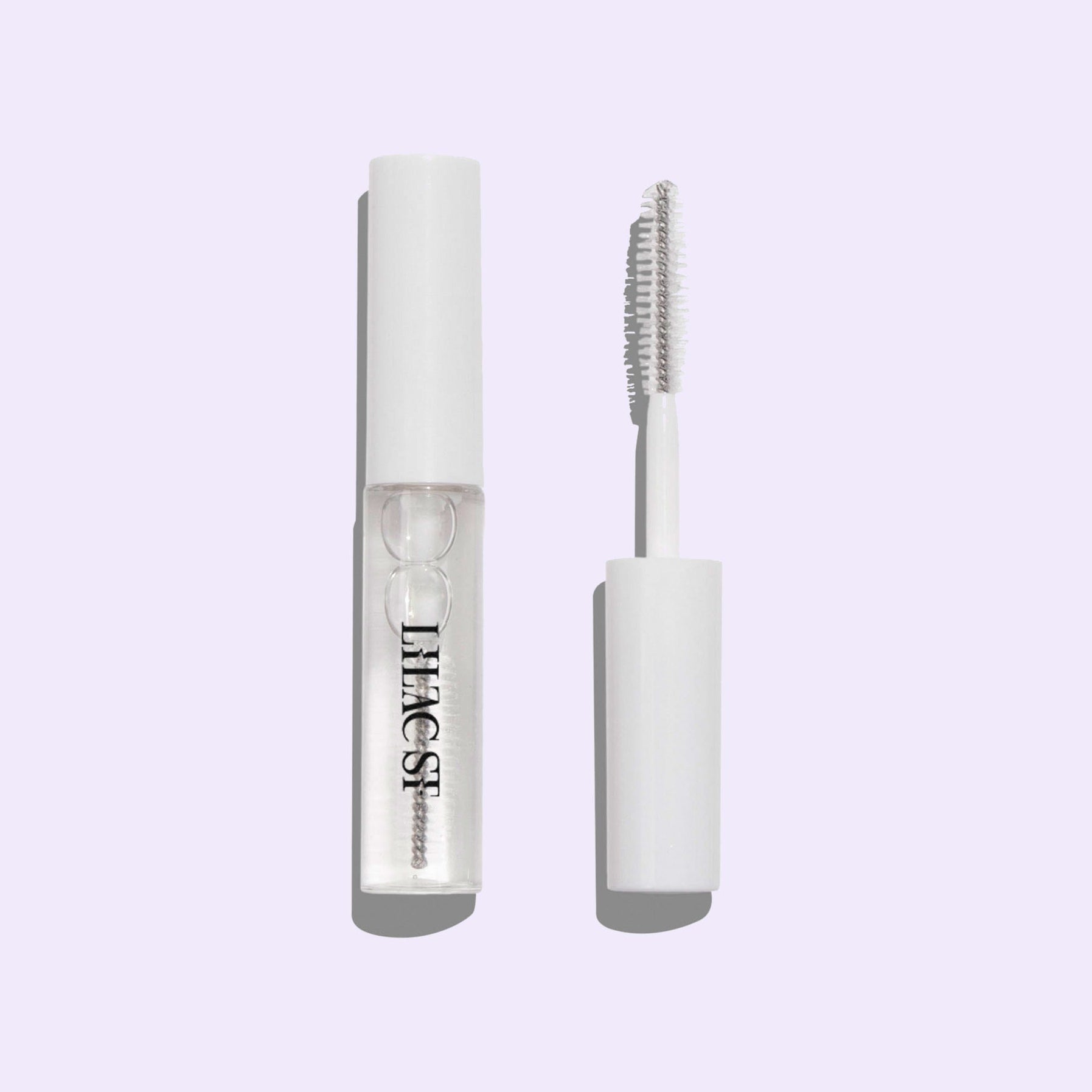 Lilac Lash Crystal coat container shown with its applicator brush integrated in the cap.