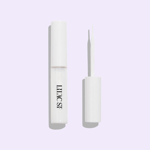 Lilac Lash Glue (Lock-It Bond) in clear with a cap integrated applicator brush