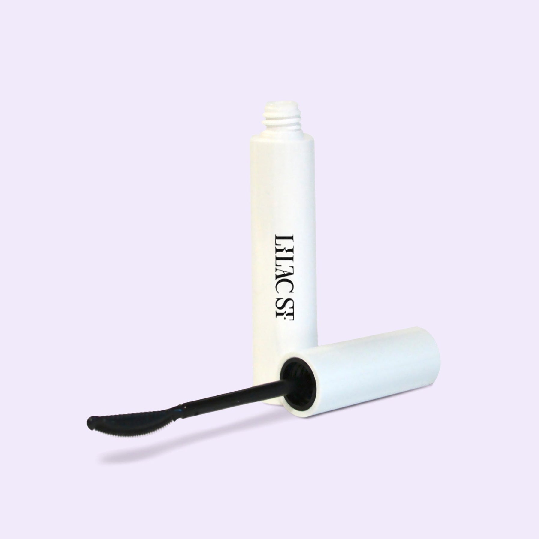 Lilac St. Ciao for Now lash remover displaying the container and the applicator brush next to each other at an angle