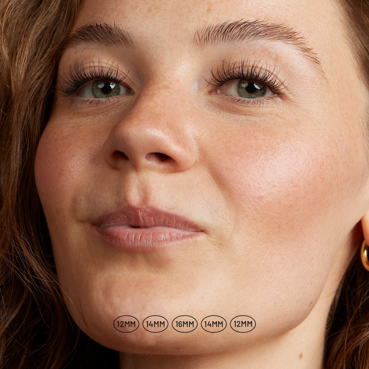 Aura NanoSoft lash clusters on a model, showing a natural, lifted look with cluster lengths labeled beneath the face.