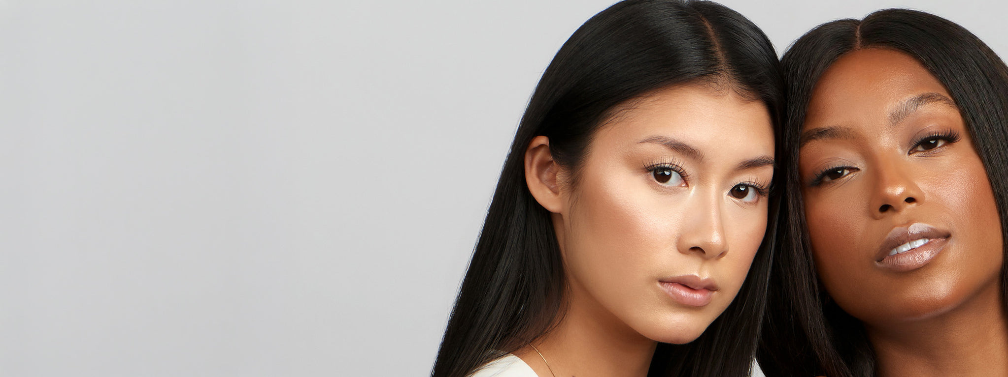 Two women with refined, lifted lashes facing the camera, showcasing Cherie NanoSoft lash clusters from Lilac St.