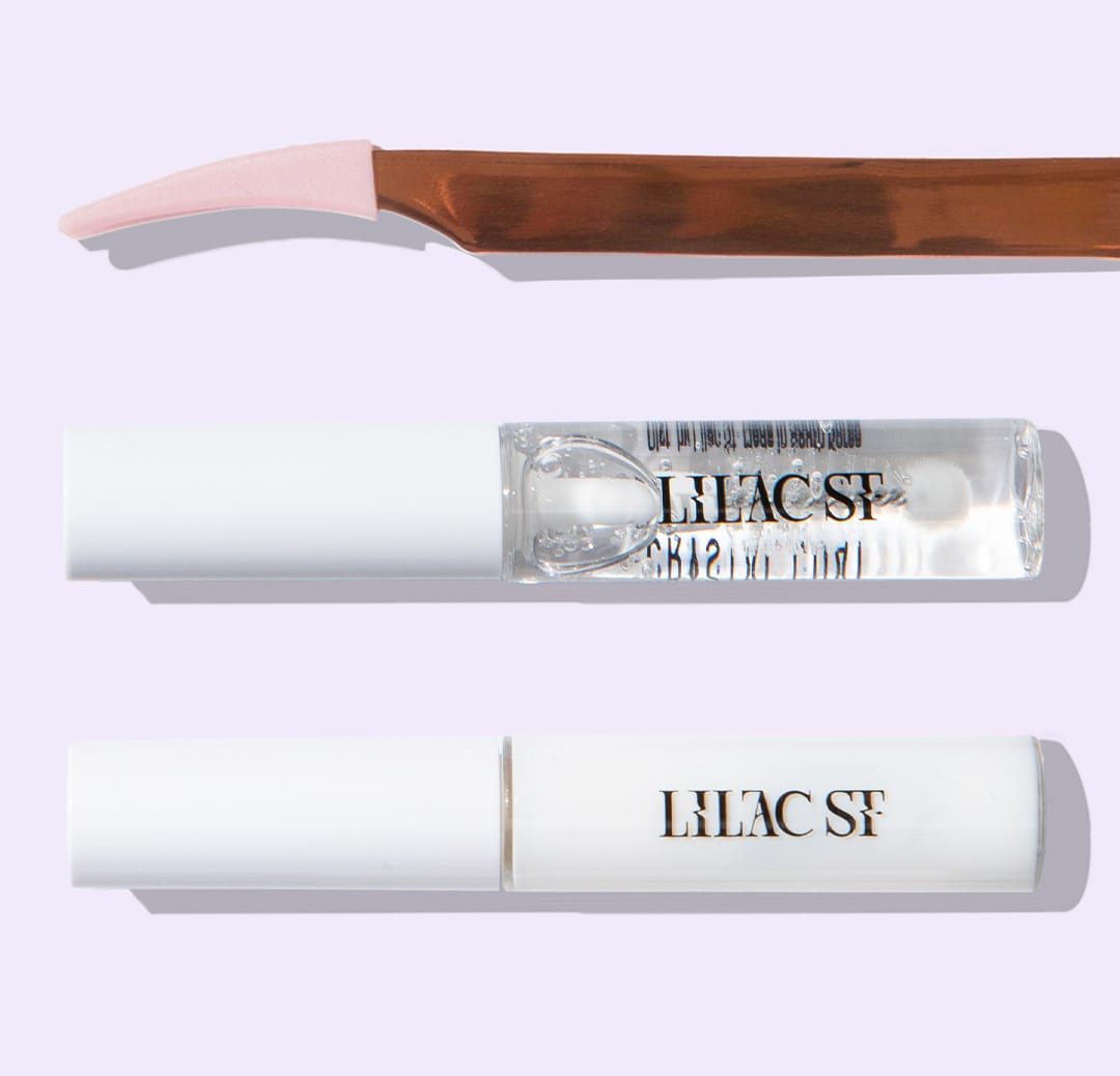 Lilac St. lash applicator with applicator tips, Lilac Lash Crystal Coat, and Lilac Lash Glue in Clear