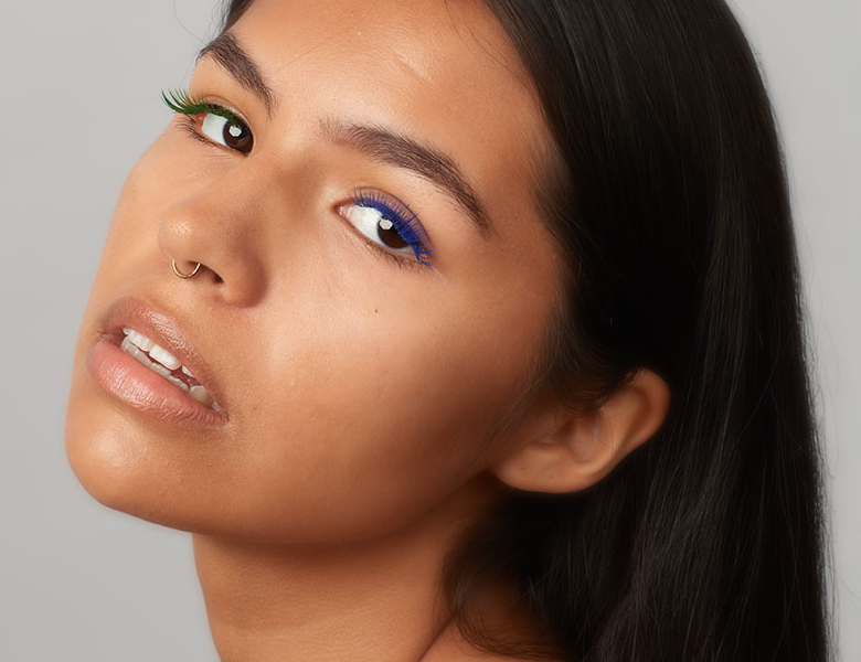 Close-up of a woman wearing Lilac St. lash clusters with a lifted, natural look.